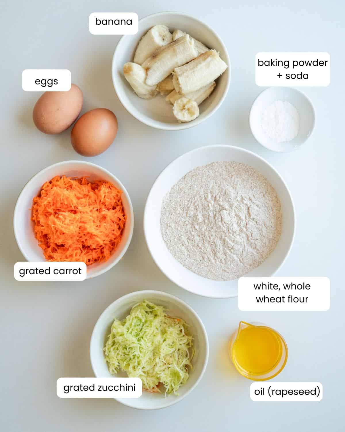 All ingredients needed to make carrot zucchini banana muffins.