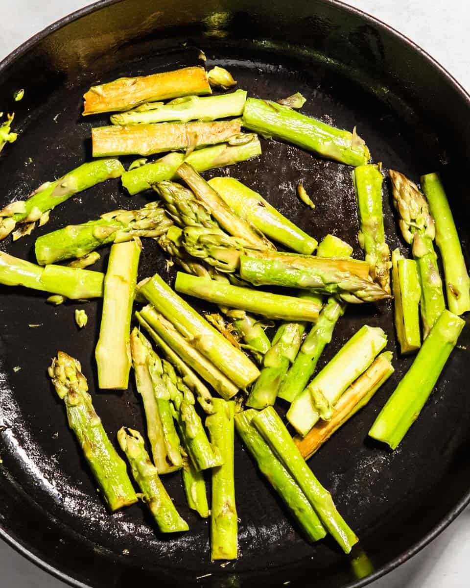 Roasted asparagus in a pan.