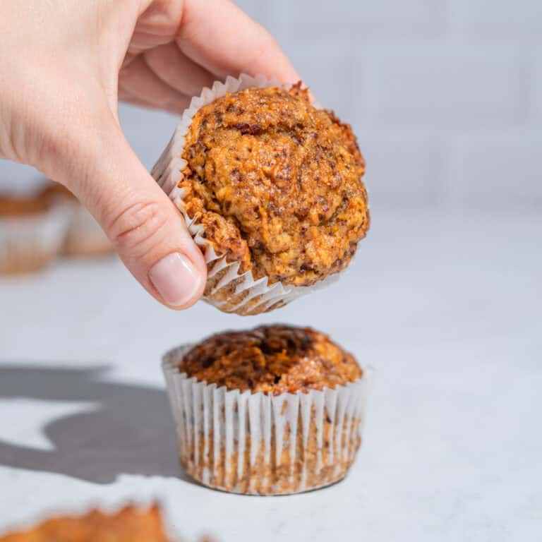 2 carrot date muffin, the upper one being taken away.