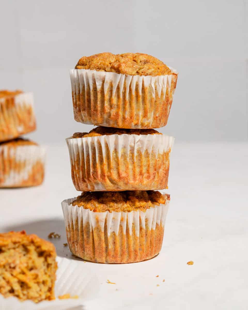 A stack of 3 carrot banana zucchini muffins.