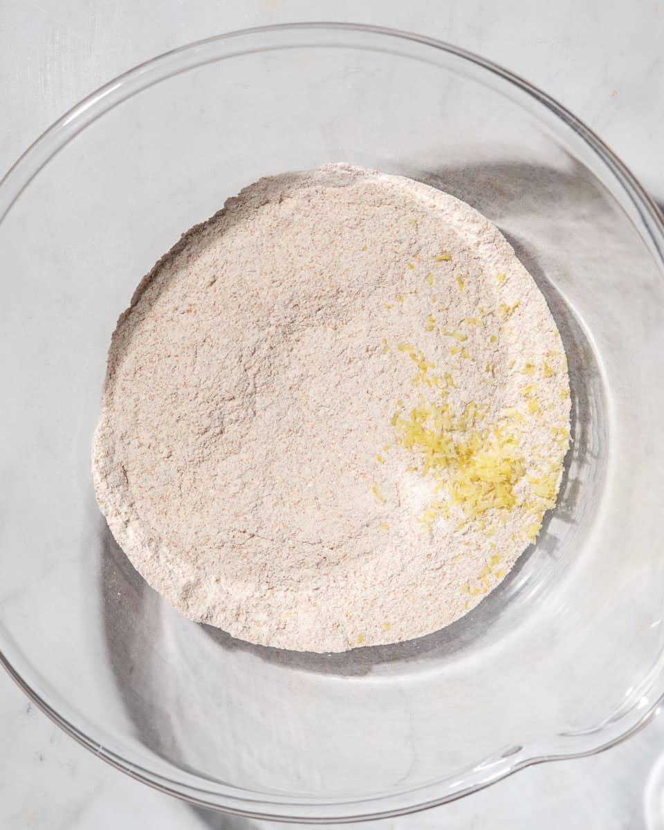 Dry ingredients and lemon zest in a bowl.