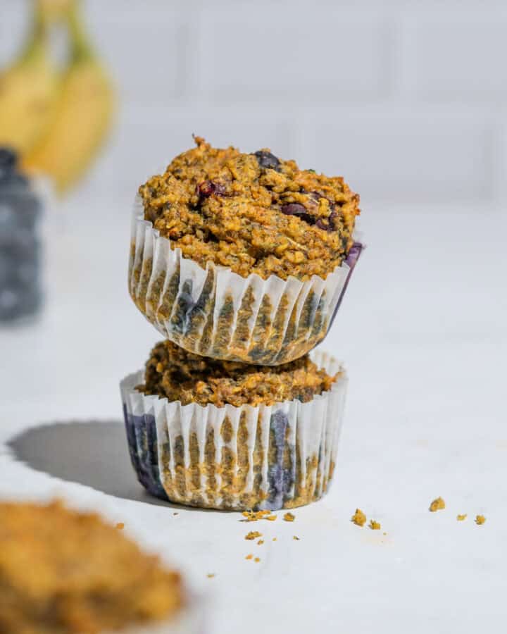 2 high fiber muffins muffins stacked onto each other.