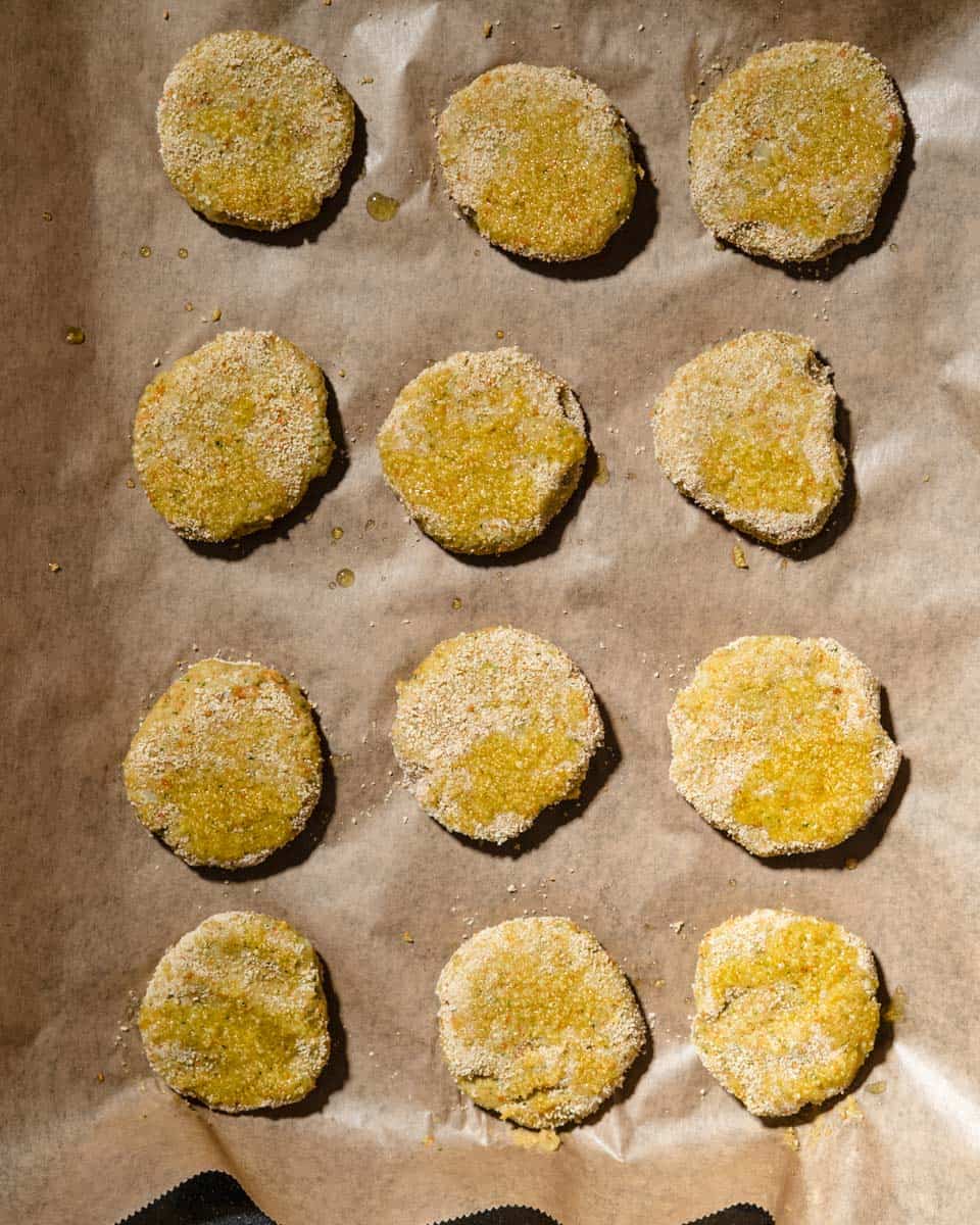 Veggie nuggets on a baking sheet with parchment paper.