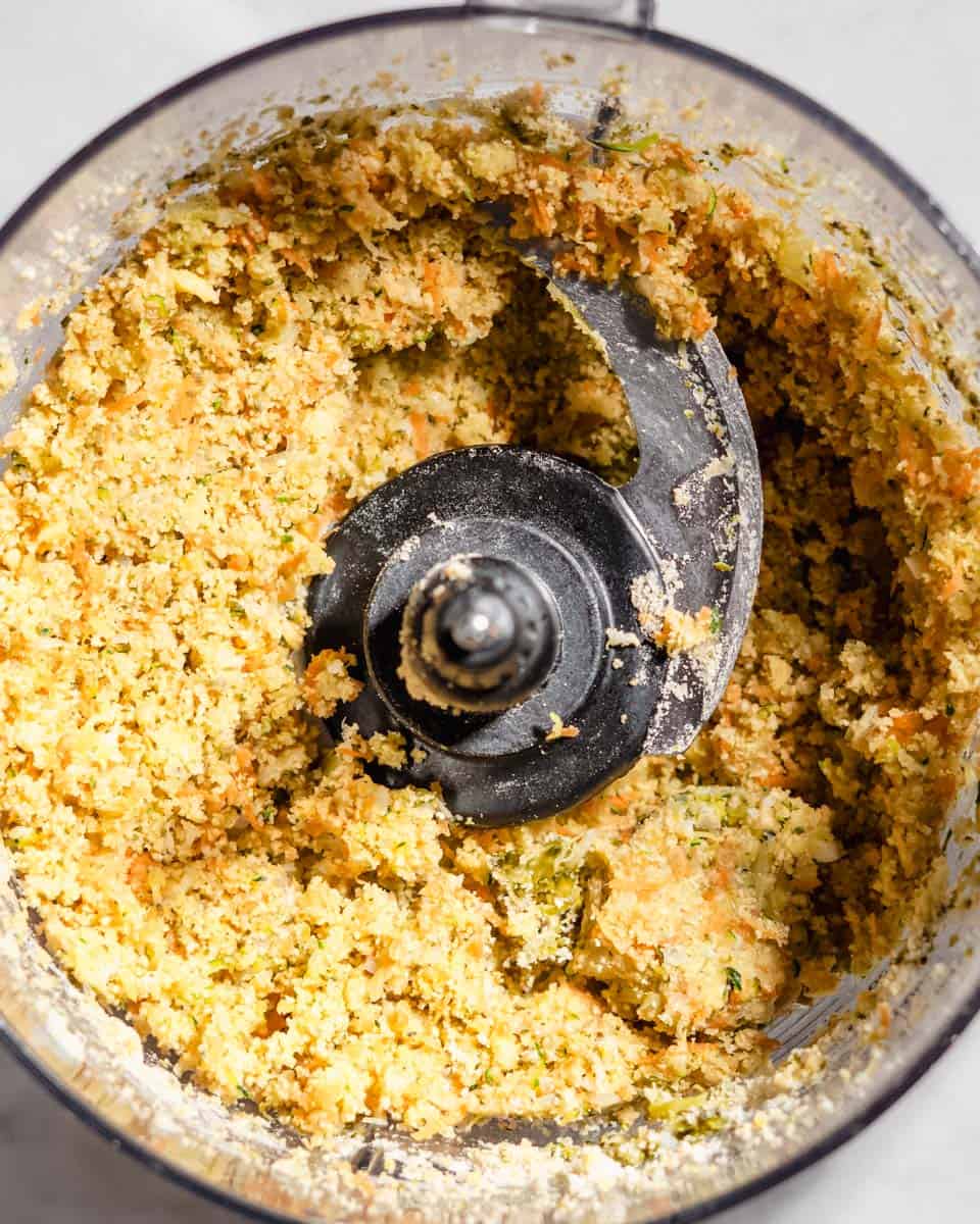 Blended veggie nugget mass in a food processor.