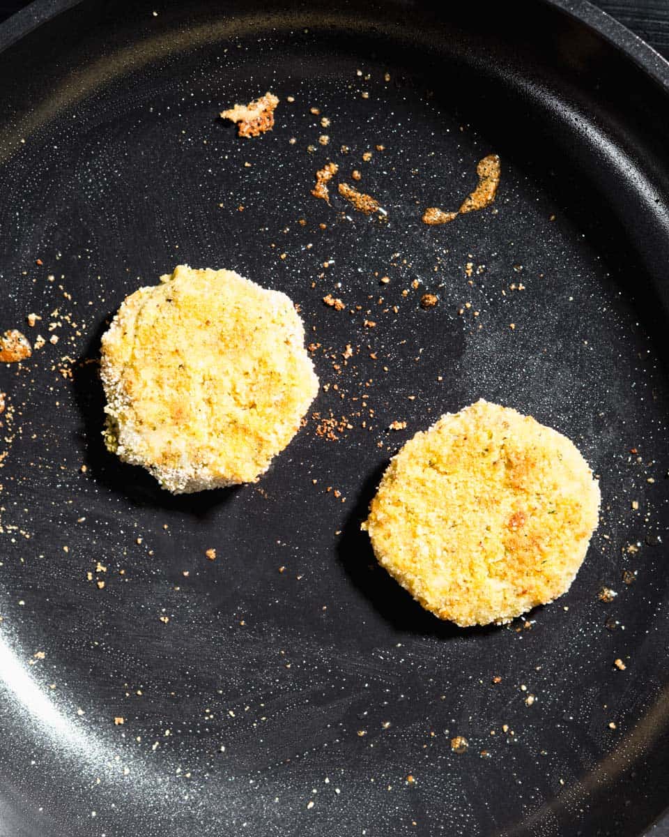 Veggie nuggets being pan-fried.